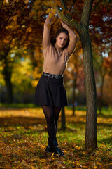 Latin lady in a colorful park in the autumn