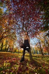 Latin lady in a colorful park in the autumn