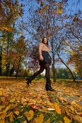 Latin lady in a colorful park in the autumn