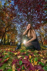 Latin lady in a colorful park in the autumn