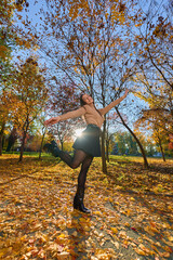 Latin lady in a colorful park in the autumn