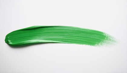 Obraz premium Green paint brush stroke on white background