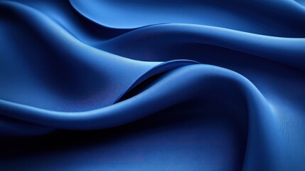 Obraz premium Abstract background of blue fabric with soft folds and smooth texture.