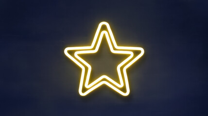 A glowing yellow neon star symbol against a dark blue background, radiating brightness and highlighting its iconic shape.