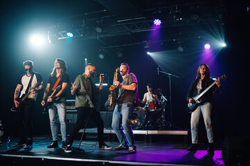 Music band performing live on stage during a concert