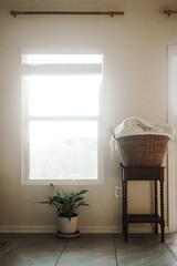 laundry sitting on table by window