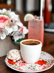 Cozy Cafe Setting with Turkish Coffee and Floral Accents