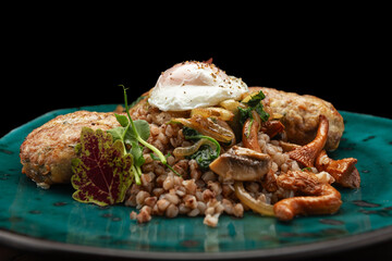 Buckwheat porridge with cutlets with fried mushrooms and poached egg