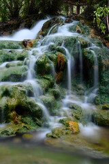 Soa Hot Spring Waterfall in Mangeruda, Flores, Indonesia with Thermal Water Flowing over Rocks