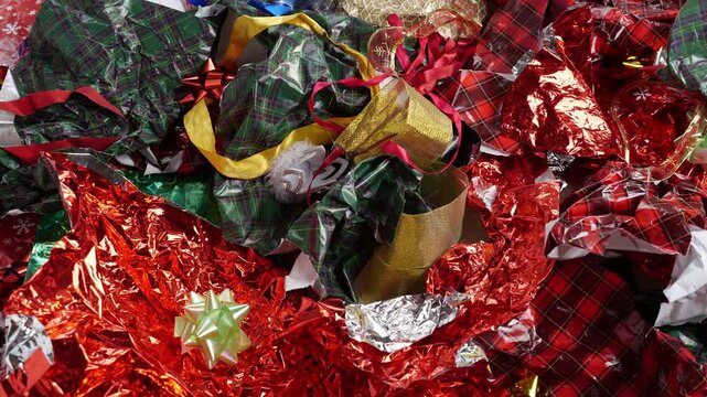 Christmas wrapping paper waste. Used packaging materials for gifts and disposable holiday decorations