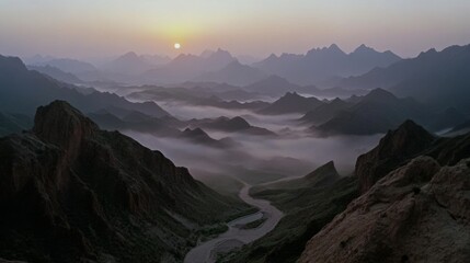 Thick fog blankets rolling hills, creating a haunting yet captivating scene as soft light filters gently across the muted landscape.