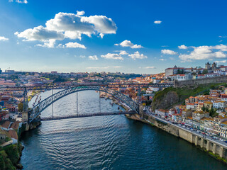Aerial drone view of Dom Luis I Bridge over Douro river and panoramic Porto view. Portugal city landscape