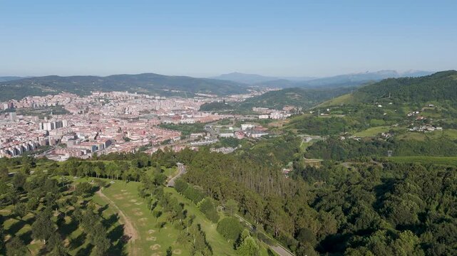 Aerial footage of Mount Cobetas with a view over Bilbao city in the province of Biscay, Spain