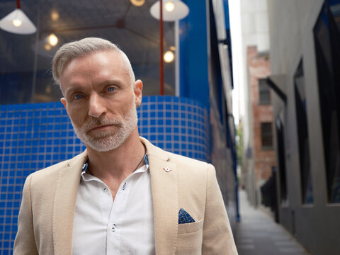 Stylish confident man in poses for portrait