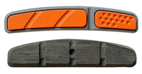 Two brake pads on isolated background. New and worn brake pad.