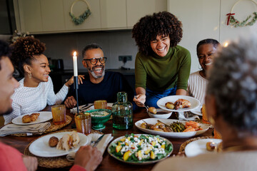 Happy family enjoying christmas dinner together at home