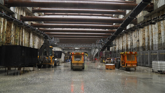 Tunnel vehicle at metro station construction under rain