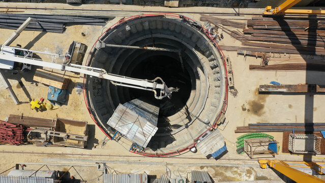 concrete mixer sends cement into subway tunnel shaft