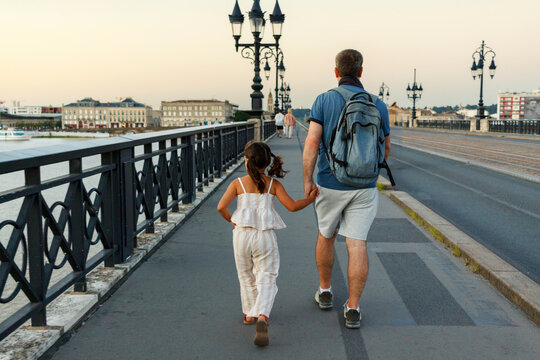 Father and Daughter back view