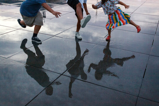 kids jumping reflection