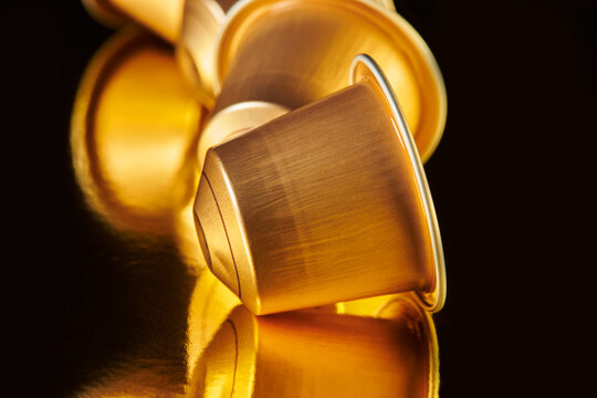 Closeup of Gold Coffee Pods 