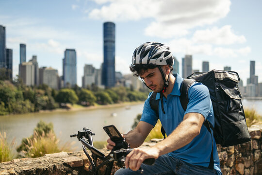 Delivery guy using smartphone