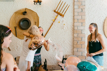 Women Hugging at Party Celebration