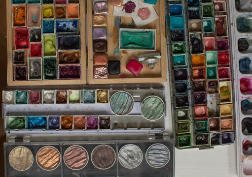 Palette with different watercolor paints