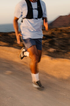 Shot blurred by the movement of an anonymous professional runner