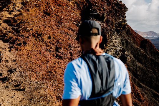 Sportsman visualizing his route through the trails of a volcano