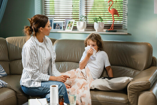 The child is blowing his nose