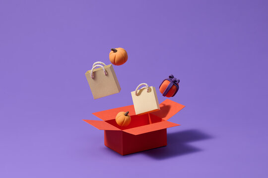 Vibrant Halloween-themed gift box with small pumpkins and gift b