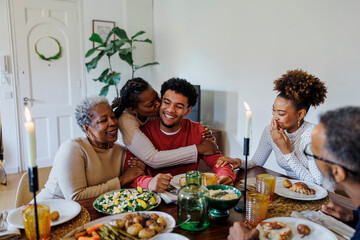Happy family enjoying meal together around a table
