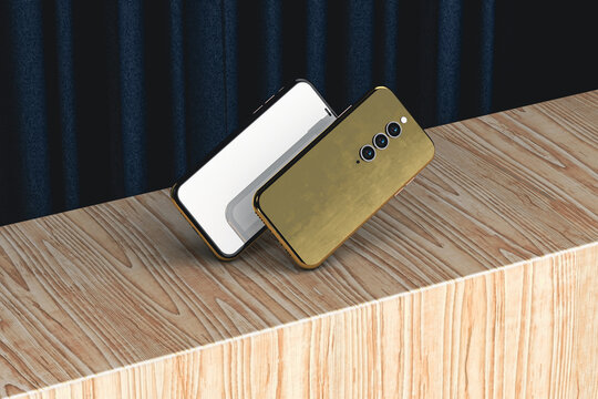 Two gold mobile phones on stage with curtain and wooden backdrop