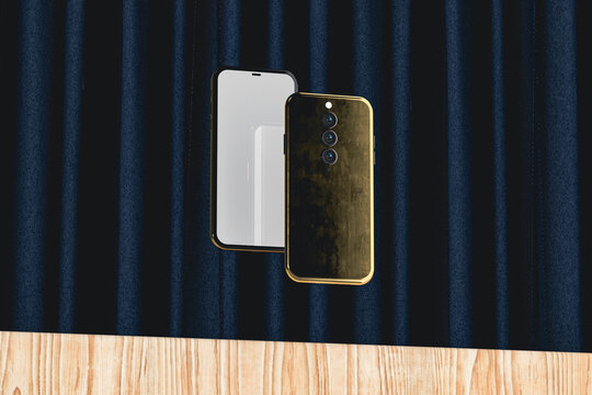 Two gold mobile phones on stage with curtain and wooden backdrop