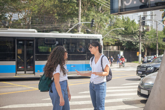 Two Young Women talking at Faria Lima Street in S&atilde;o Paulo