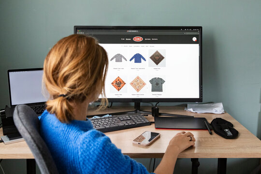 Woman browsing clothes and accessories in an online store