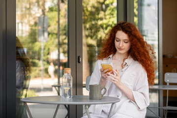 White woman texting message on the phone