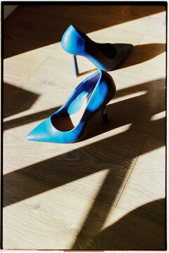 blue high heels on the wooden floor, 35mm
