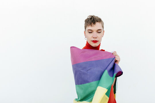 Dreamy gender neutral model with LGBT flag