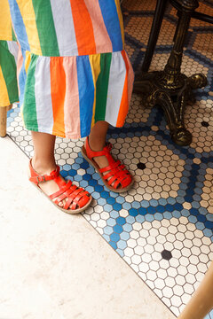  colored  dress and red sandals 