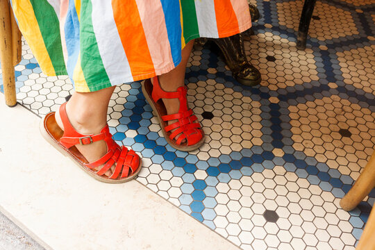  colored striped dress and red sandals 