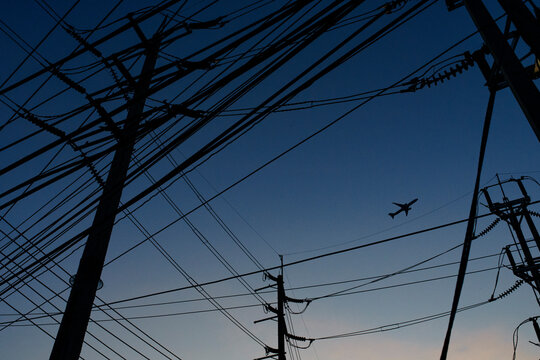 Utility poles at sunset