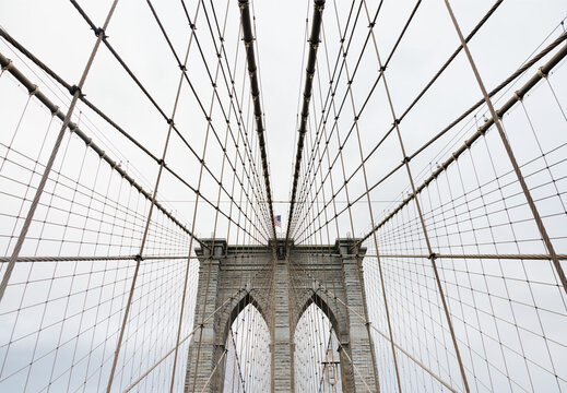 Architectural lines and steel cables of the Brooklyn Bridge in NYC