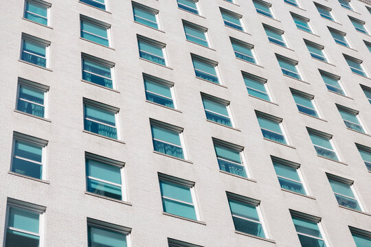 Symmetrical pattern of windows on a building in New York City