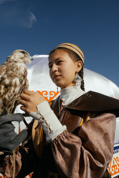 Portrait of a girl with a falcon