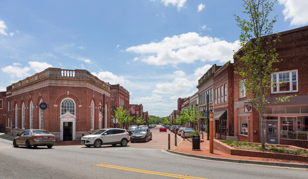 GREER, SC, USA 24 APRIL 2022: Intersection of Poinsett and Trade Street, showing Barista Alley building.  Sunny, spring day.
