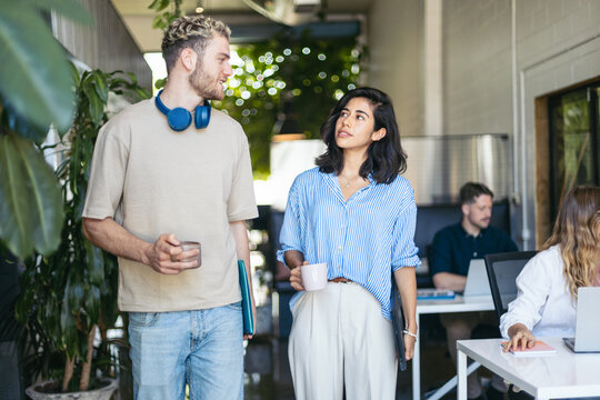 Coworkers chatting in the office