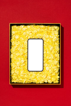 White screen phone in a box filled with yellow packaging foam