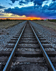 Railroad tracks in a straight line from East to West. The railroad was key to building many...